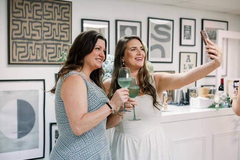Two guests toasting at the first Golden Palm Society gathering