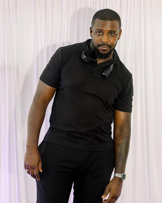 The DJ photographed at the backdrop