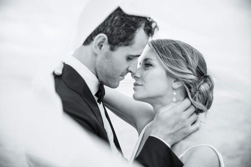 Black and white, a bride and groom close together on their wedding day