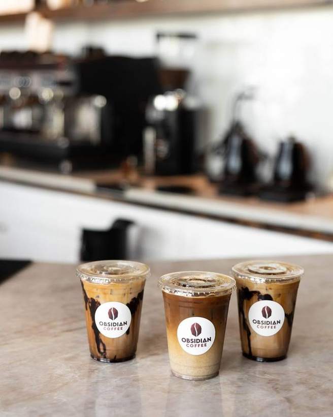 Three branded iced coffees on the counter